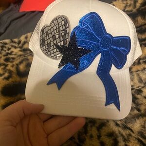 White Cap with Blue Bow and Black Star